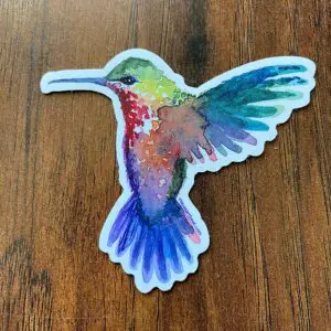 Multicolored bird sticker on table