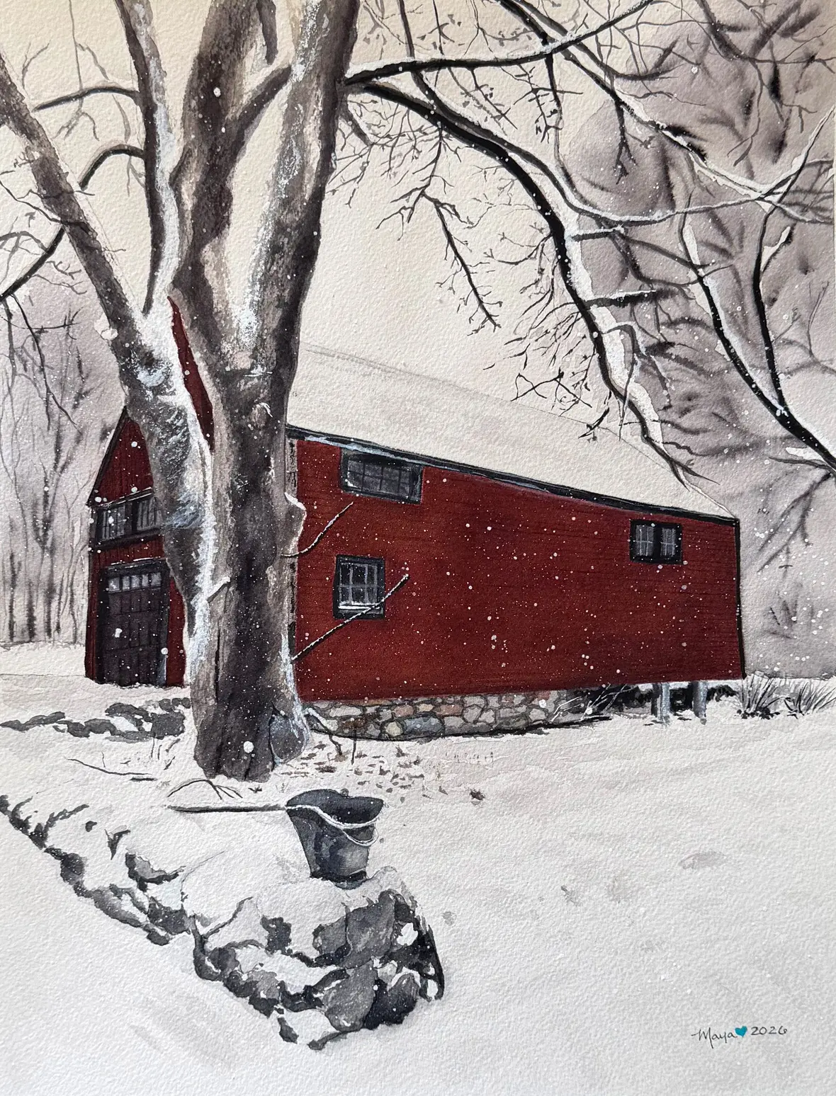 Red barn in snowy winter landscape