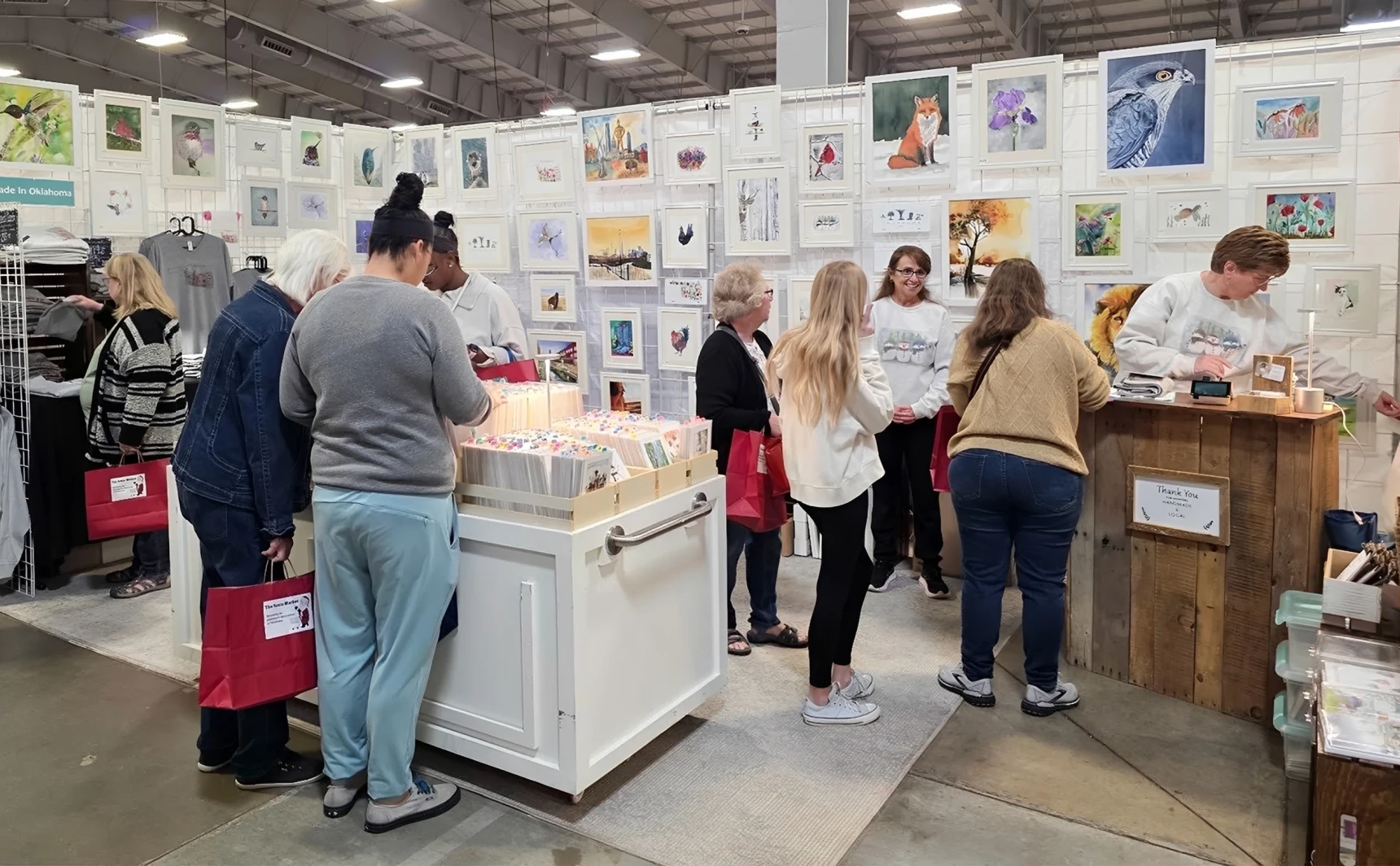 Art booth with browsing visitors