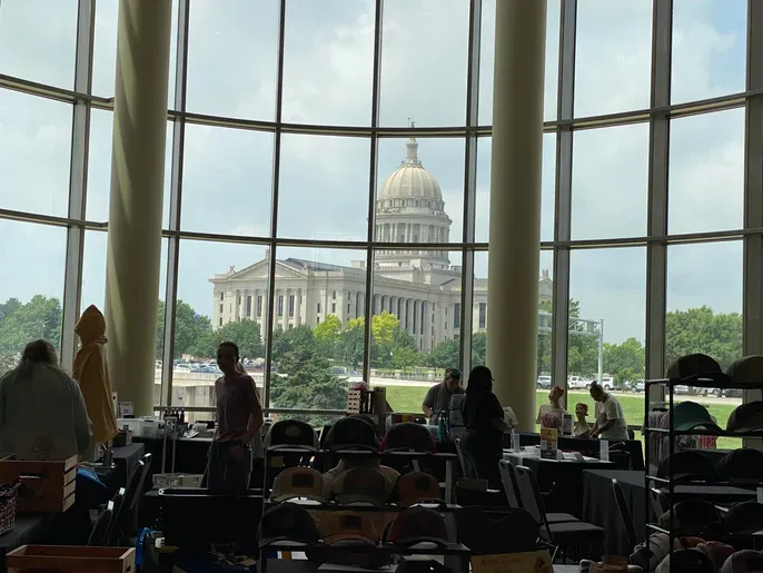 Capitol dome visible through large glass windows