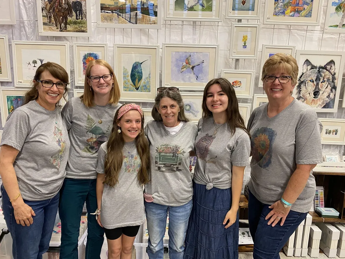 Group of women and girls in matching shirts