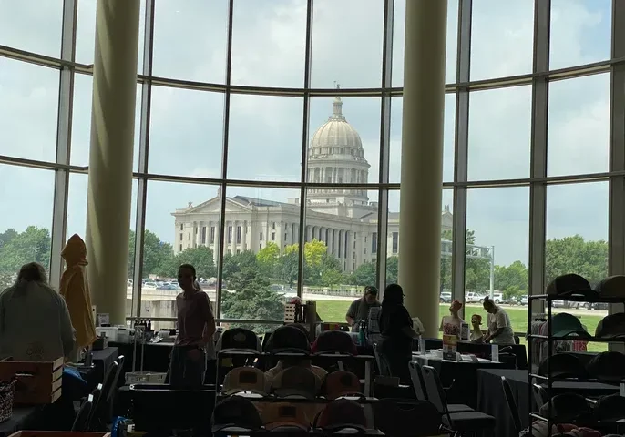 Capitol dome visible through large glass windows