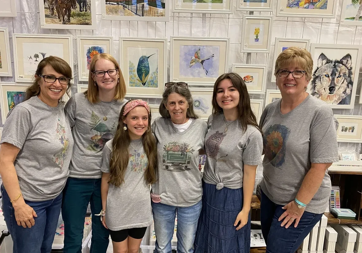 Group of women and girls in matching shirts