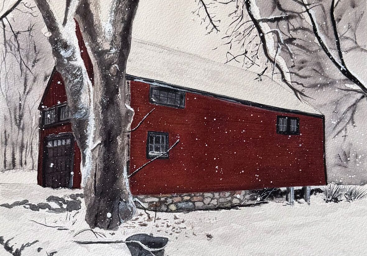 Red barn in snowy winter landscape
